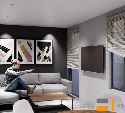 Sala de minisuite con sofá gris, muro de acento negro, cuadros decorativos y TV. Diseño interior por MMS Arquitectos en Estado de México y Ciudad de México