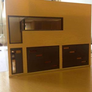 Vista frontal de maqueta de casa moderna con cocheras MMS Arquitectos