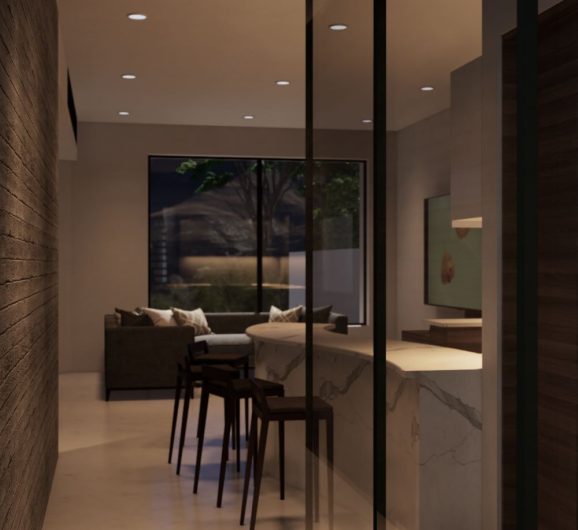 Sala comedor y cocina integral con barra de mármol, muro de piedra y ventanal. Diseño interior por MMS Arquitectos en Estado de México y Ciudad de México