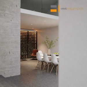 Comedor minimalista con cava de vinos iluminada al fondo, mesa blanca con sillas y muro de concreto. Diseño por MMS Arquitectos en Estado de México y Ciudad de México