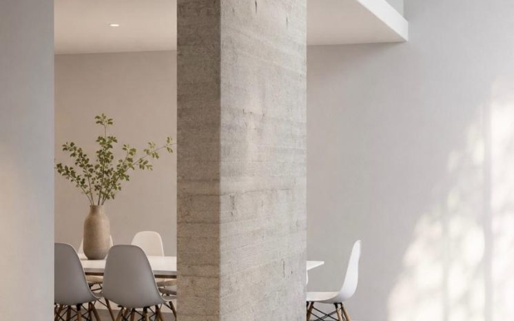 Interior minimalista con columna de concreto aparente y comedor MMS Arquitectos