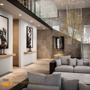 Sala minimalista a doble altura con escalera, árbol interior, lámpara colgante y sofás grises. Diseño interior por MMS Arquitectos en Estado de México y Ciudad de México